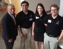 Administrator Bolden posing with minxss students in 2014