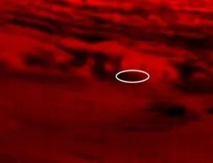 Saturn in the thermal infrared. Inside a white ellipse is where Cassini plunged into Saturn’s atmosphere.