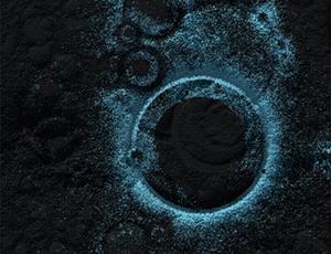 A glowing blue circle against a black background surrounded by faint, smaller blue circles
