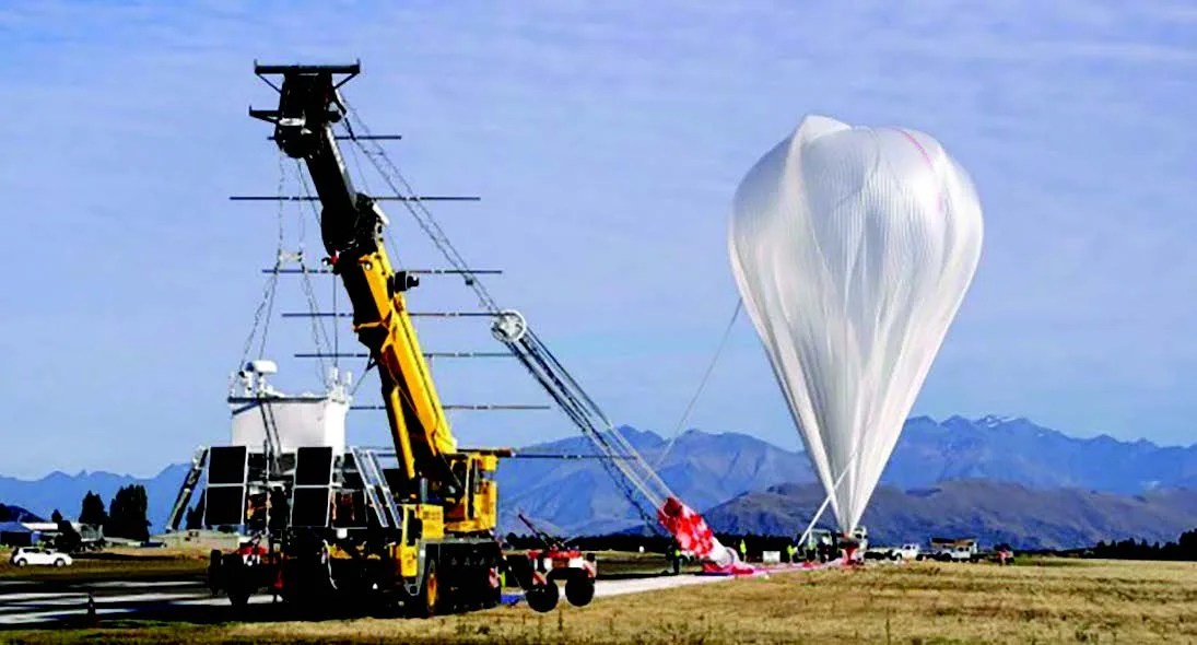 Photograph of balloon being inflated on airport tarmac