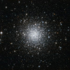 This is a globular cluster, a sphere of tens of thousands of stars. Most of them are a whitish color, and more concentrated in the center of the sphere. As you move farther from the center, there are fewer stars.