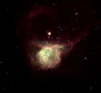 A greenish-yellow spherical glowing gas cloud, which becomes a dark pinkish-red at the edges.