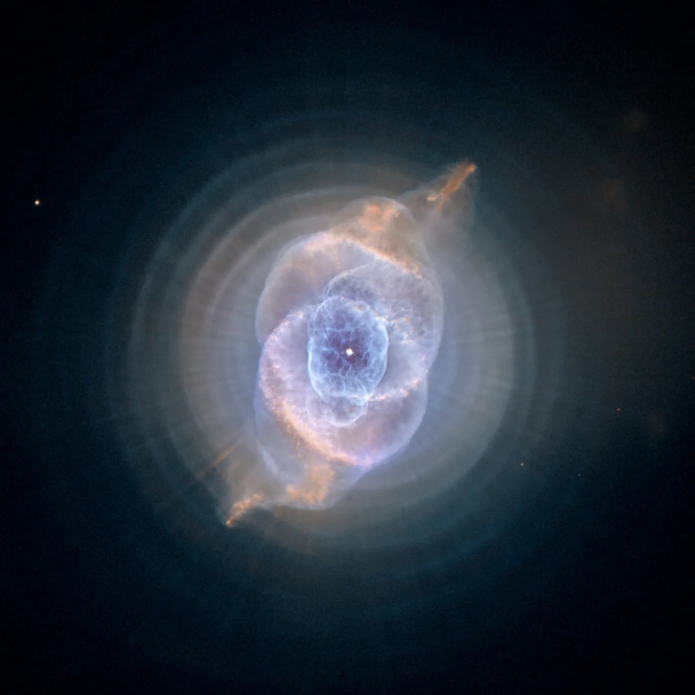 Large clouds of white dust and gas surrounding a bright white star in the center.
