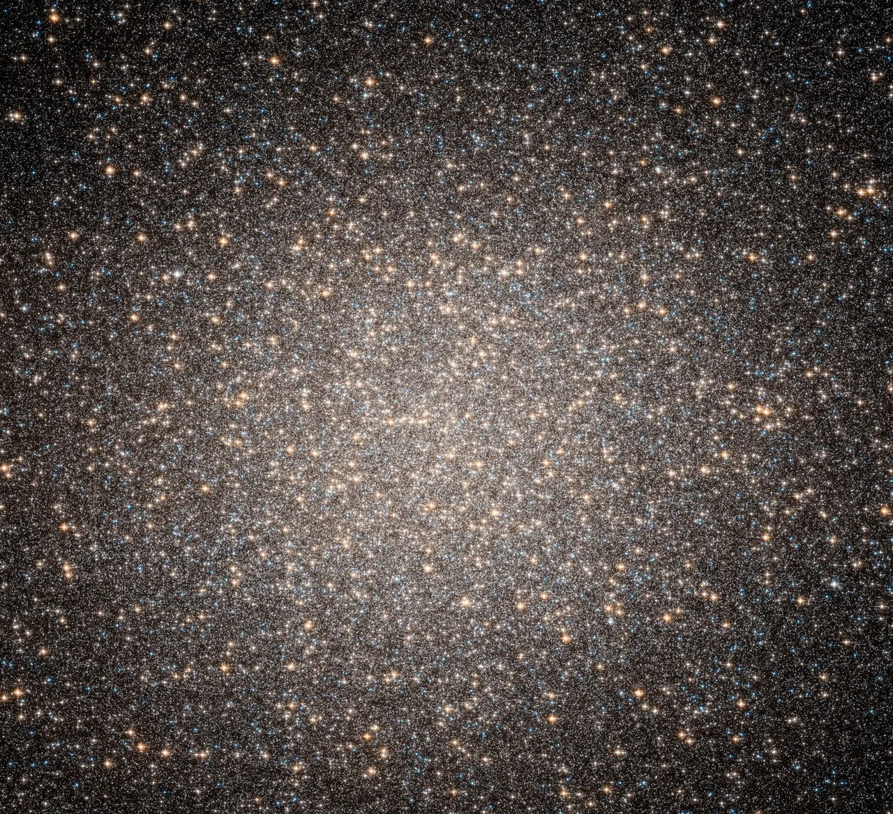 A compact spherical cluster of so many stars that their light blurs together.