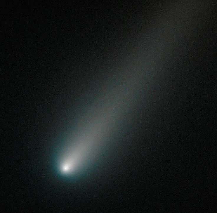 Bright comet streaks across dark space