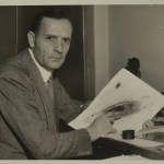 Edwin Hubble sitting at a desk holding a galaxy image.