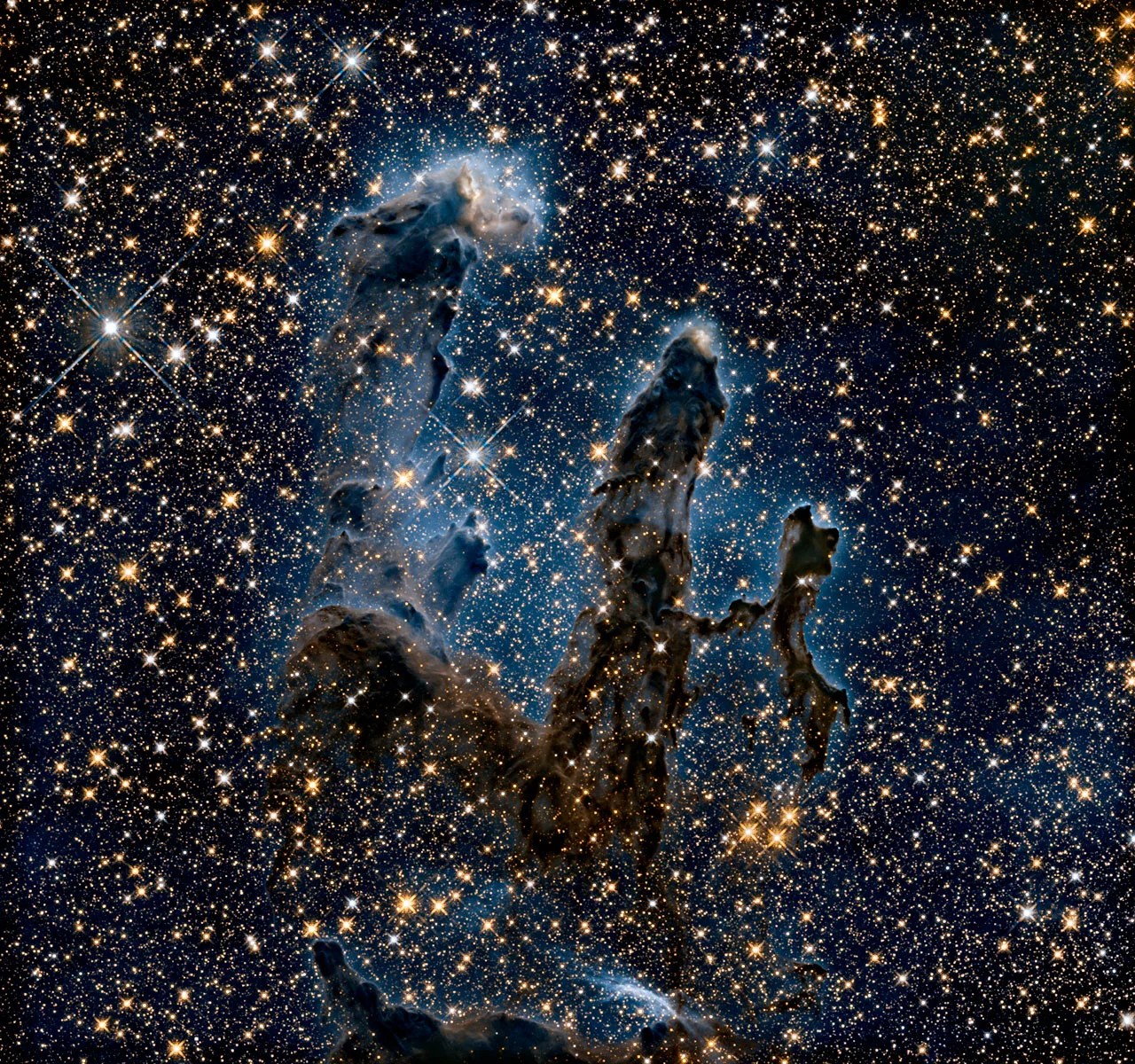 Thousands of stars are seen behind and inside the dust and gas towers in an infrared view of M16