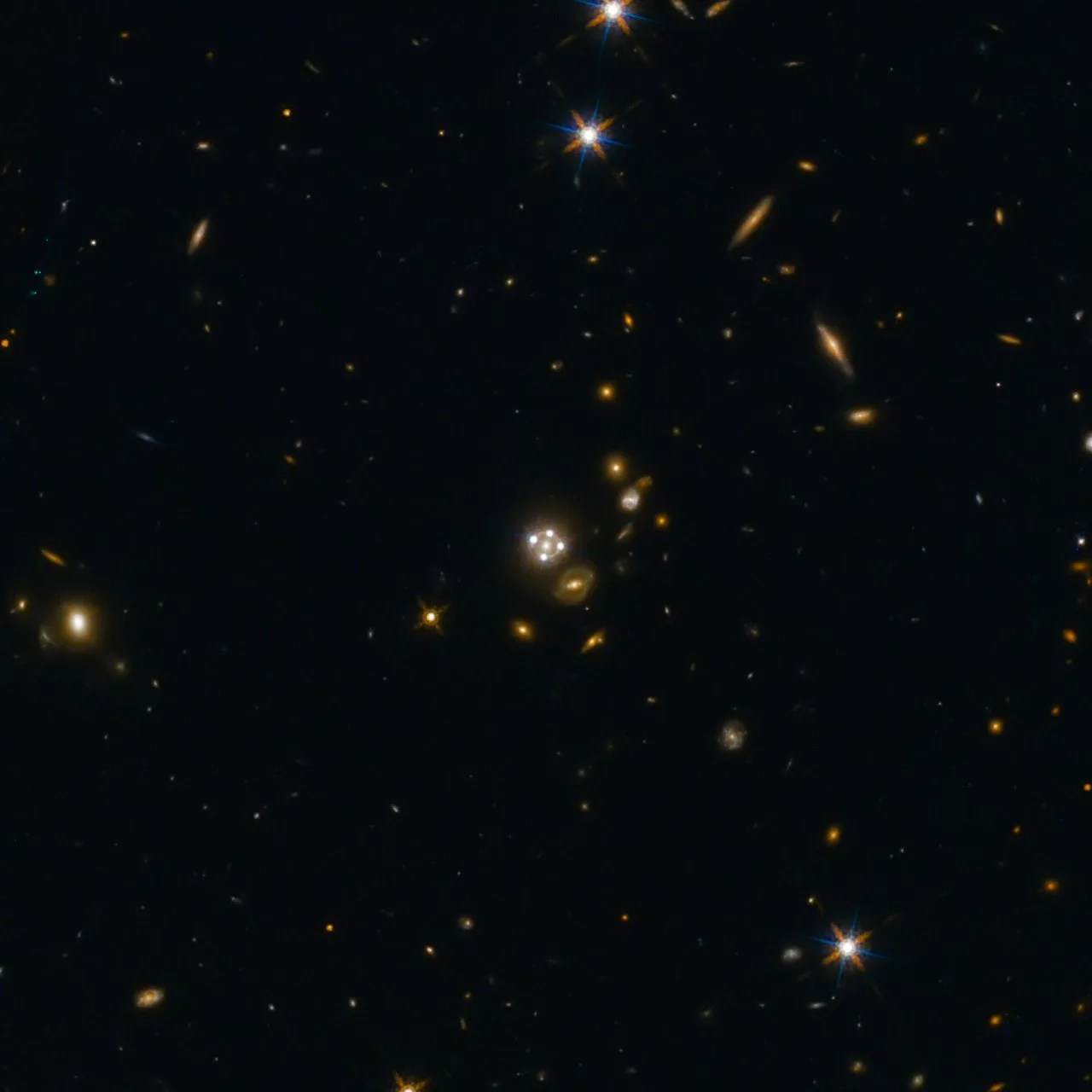 galaxies sprinkled across a star field