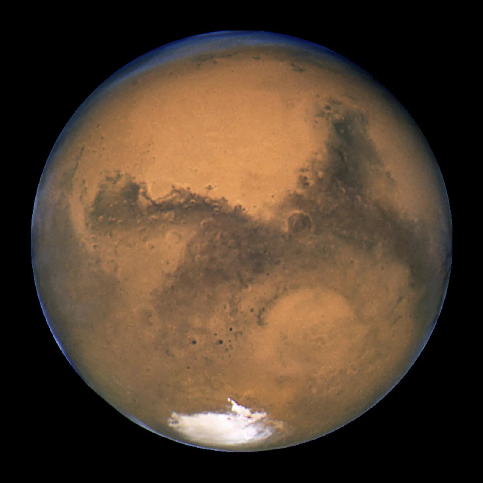 Closeup image of mars with icy-looking patch near south pole