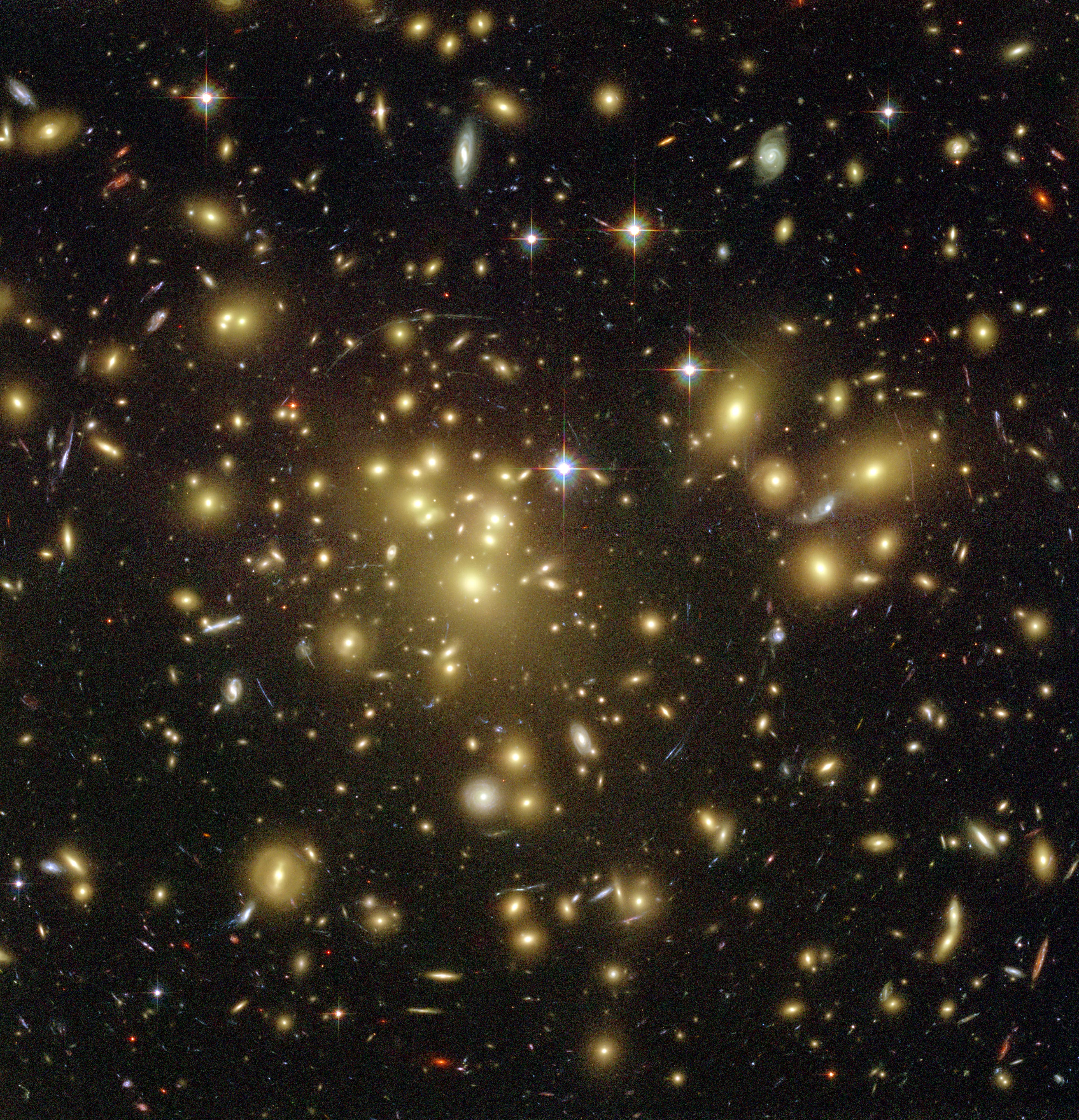 Yellowish galaxies with red and blue distorted background galaxies
