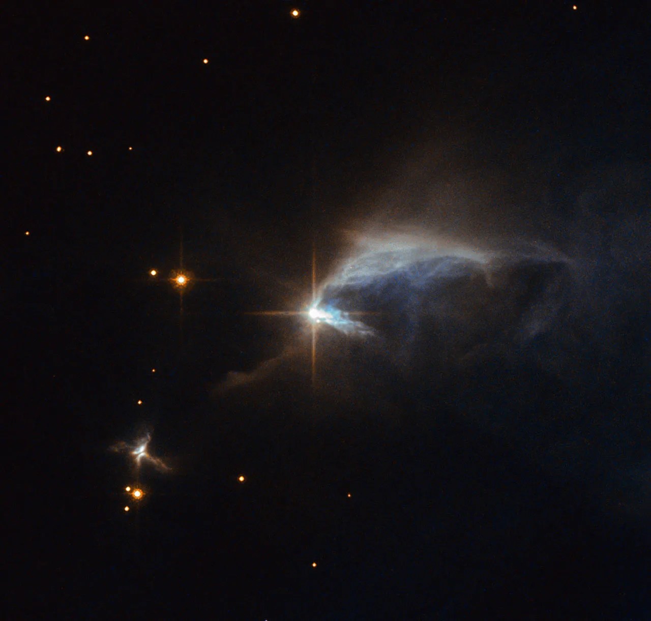 Surrounded by an envelope of dust, the subject of this hubble image is a young forming star