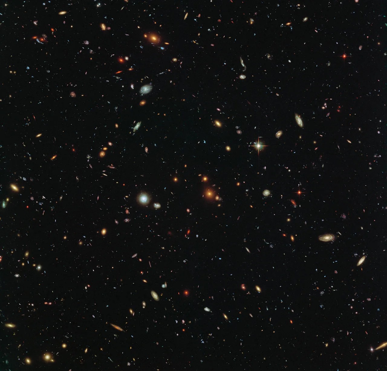 Thousands of colorful galaxies swimming in the inky blackness of space