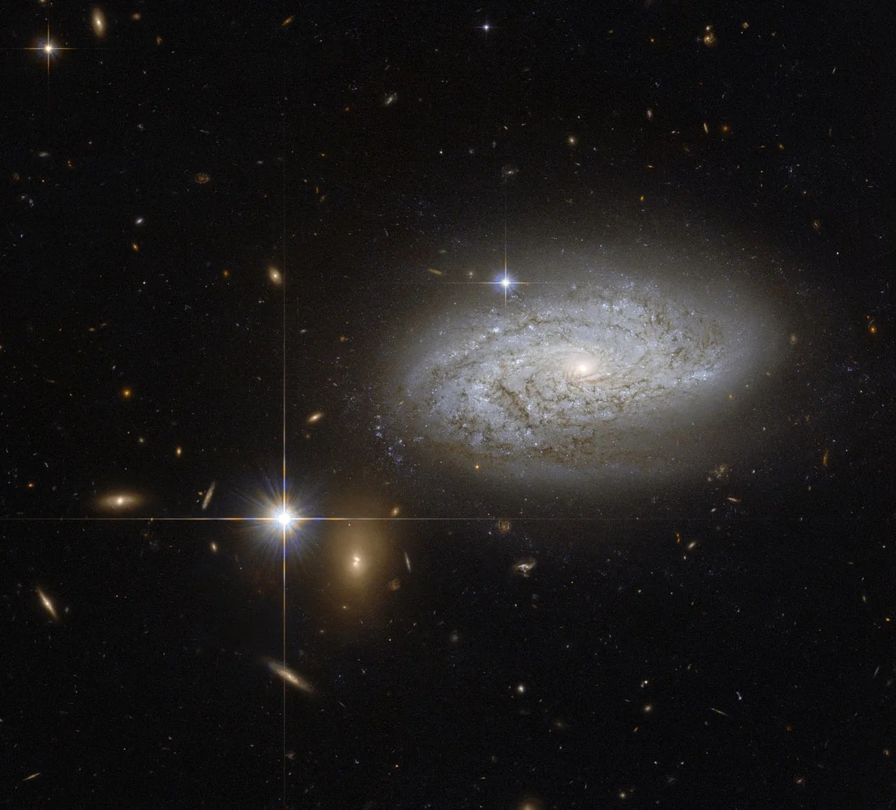 A swirl of dust and light on a field of stars