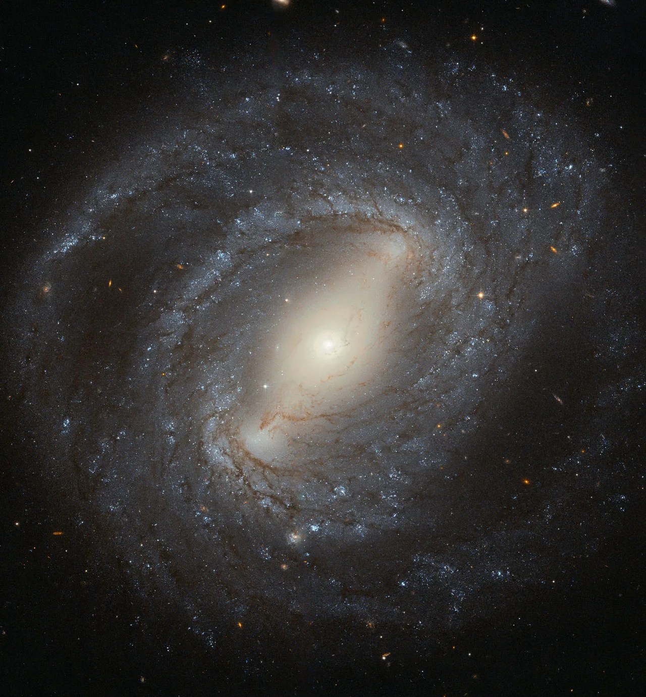 NGC 4394 is the archetypal barred spiral galaxy with spiral arms emerging from the ends of a bar that cuts through the galaxy.