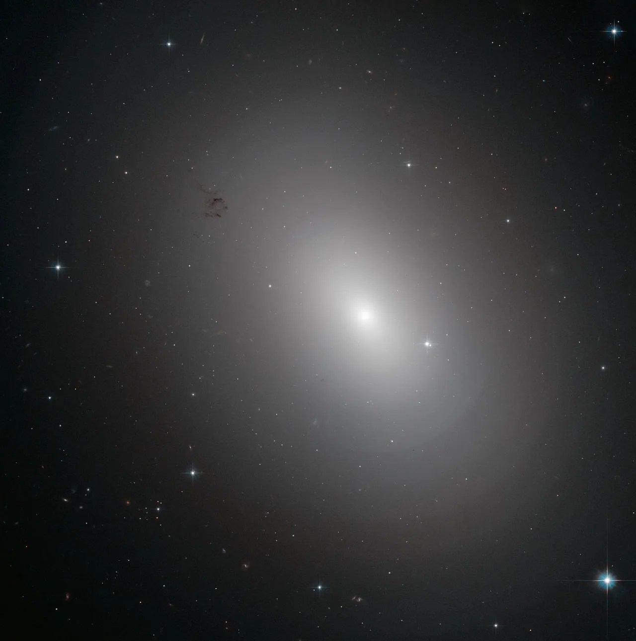 A bright halo around a star on a black background