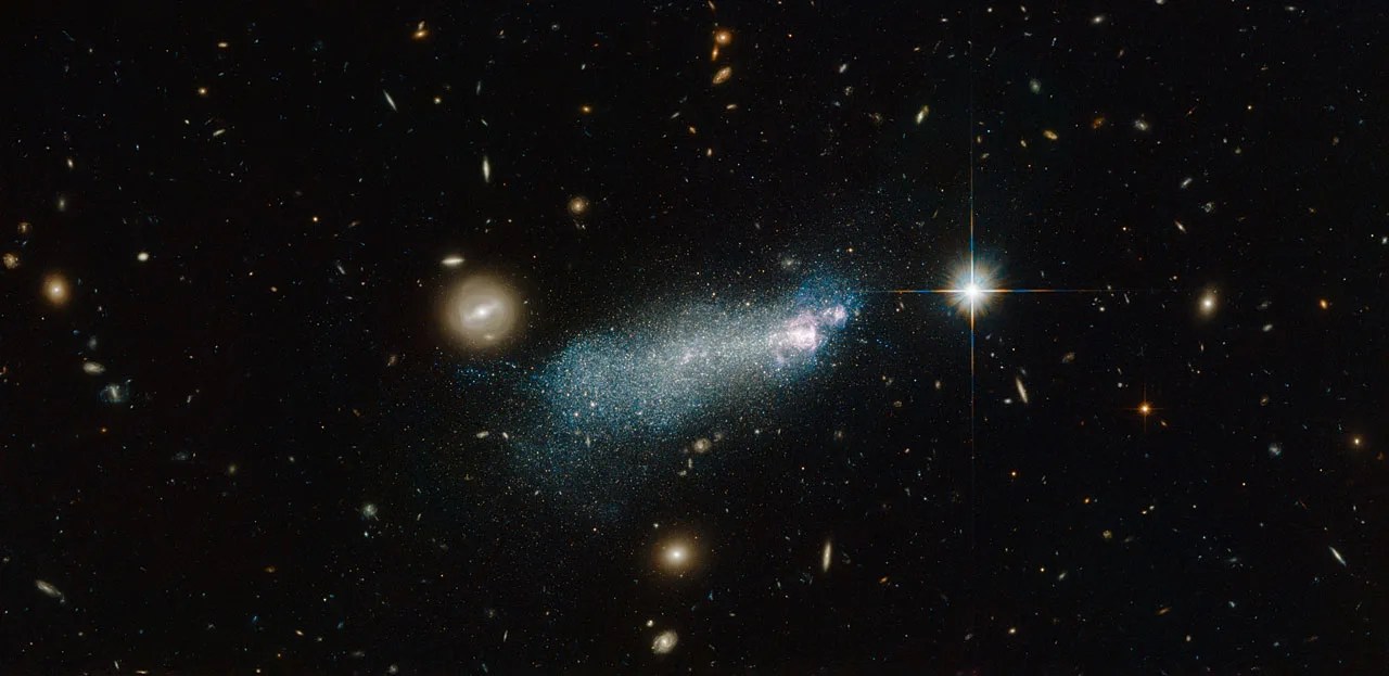 A bright streak of stars on a starry black background