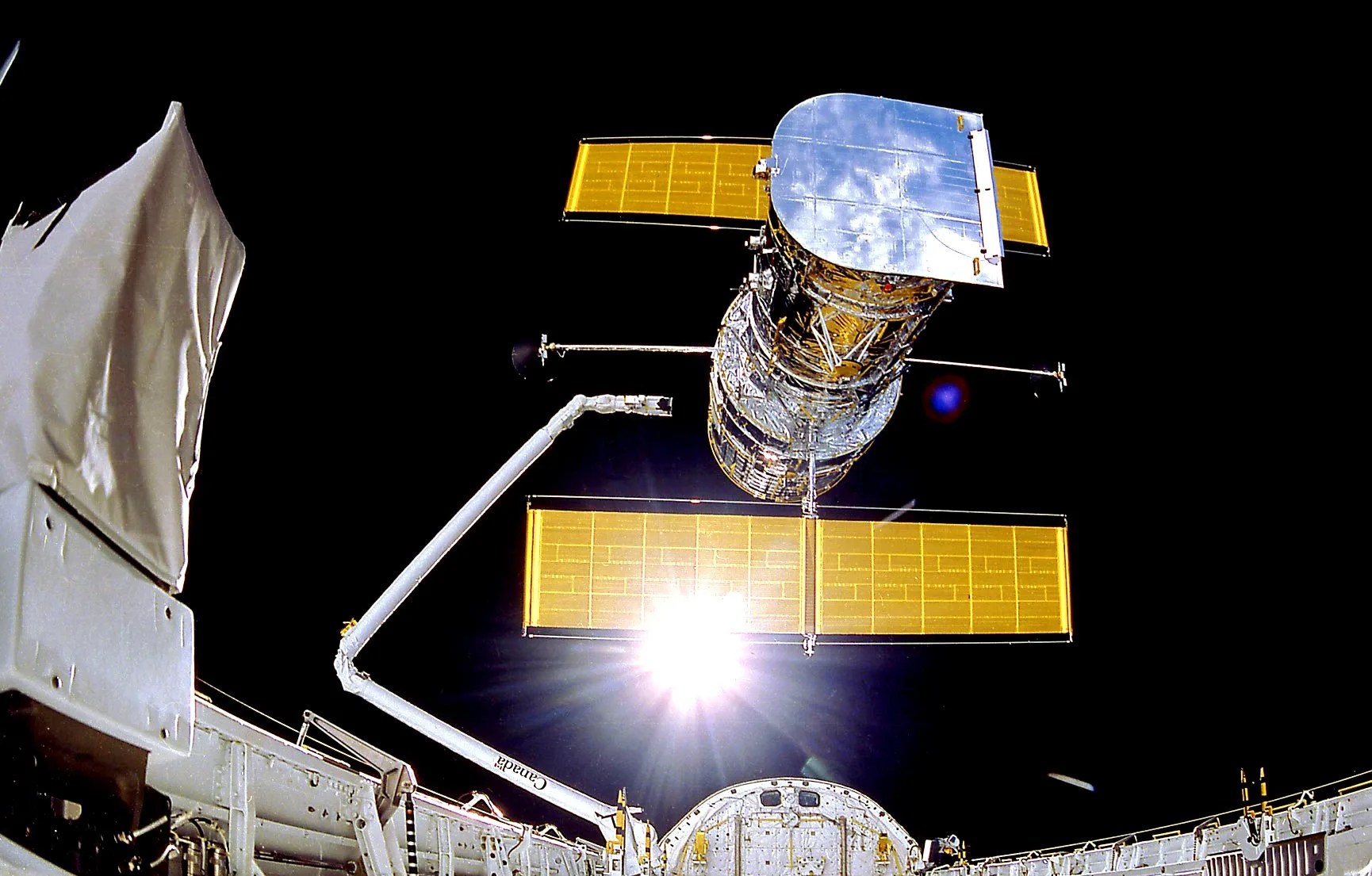 Hubble space telescope is released from discovery's payload bay.