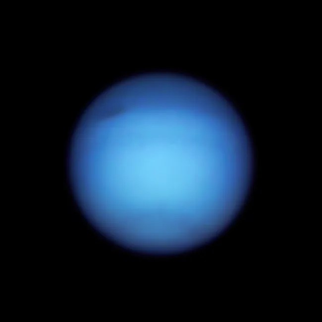 Hubble 2021 image of Neptune, a rich blue with darker bands and its dark spot in the upper left quadrant