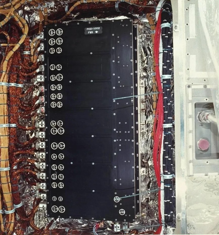 An image of Hubble's Power Control Unit shows many wires and connectors.