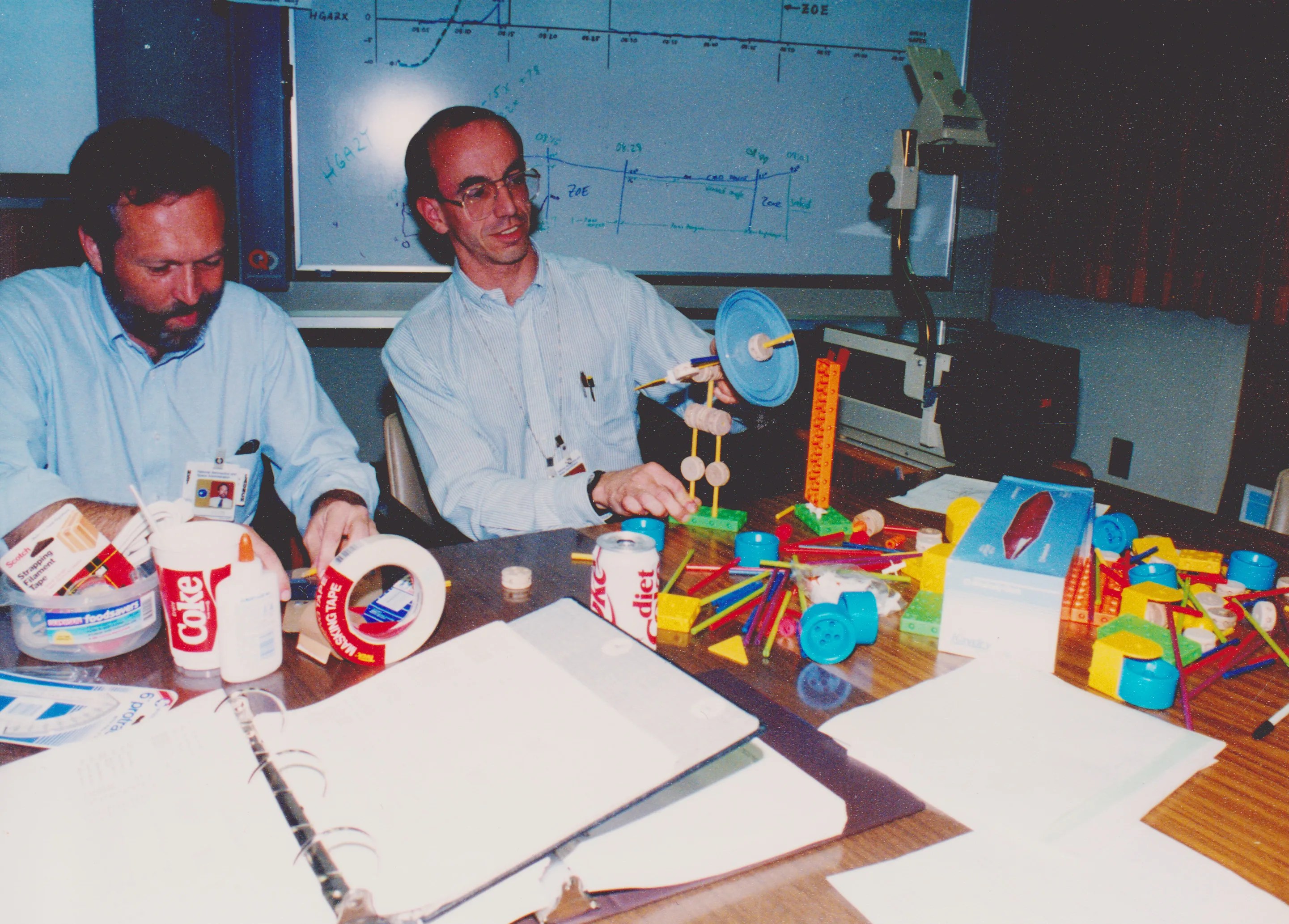 Engineers build a Tinkertoy model of the Hubble Space Telescope in 1990