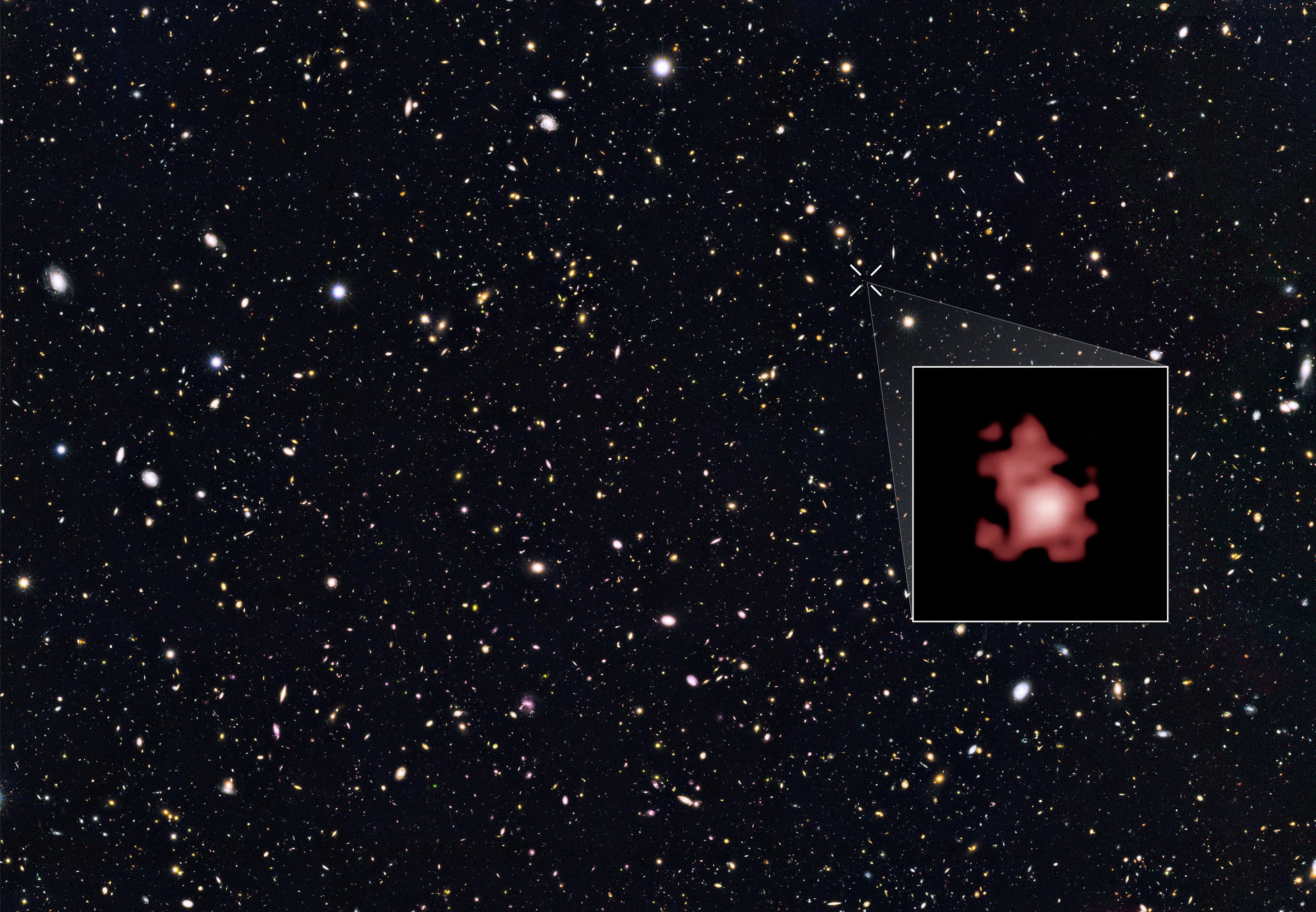 Hubble survey field containing tens of thousands of galaxies including one seen 13.4 billion years in the past