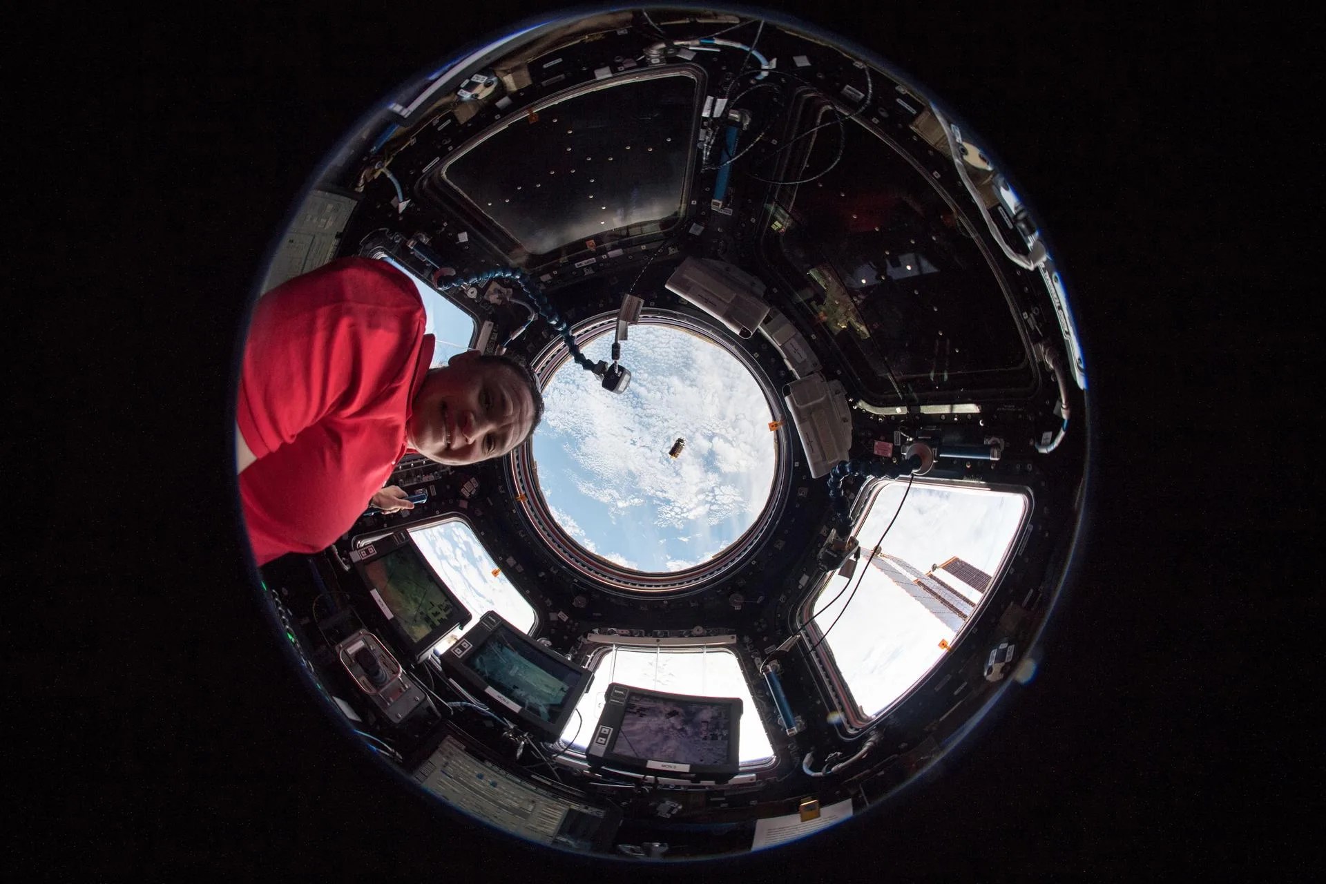 NASA Flight Engineer monitors a Japanese resupply ship.