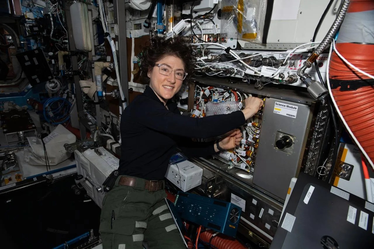 Photo of astronaut Jessica Koch working on the Cold Atom Lab