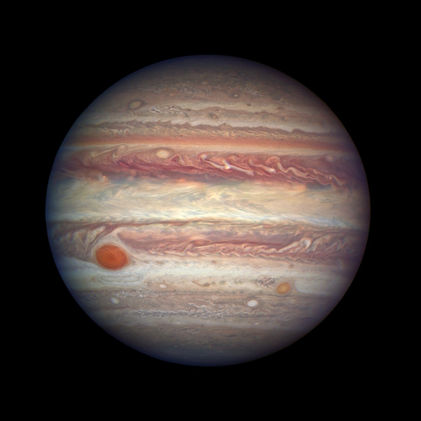 Planet jupiter with red and cream bands and red spot bottom left