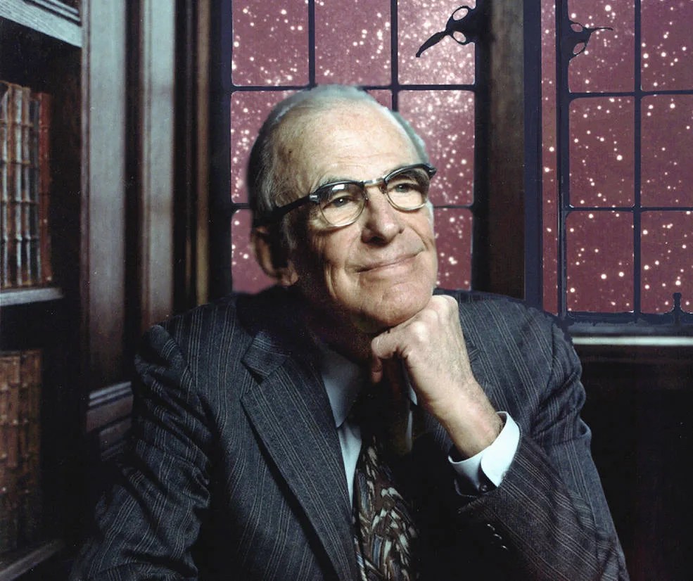 Lyman Spitzer with his chin propped on his hand. A window behind him shows many stars.