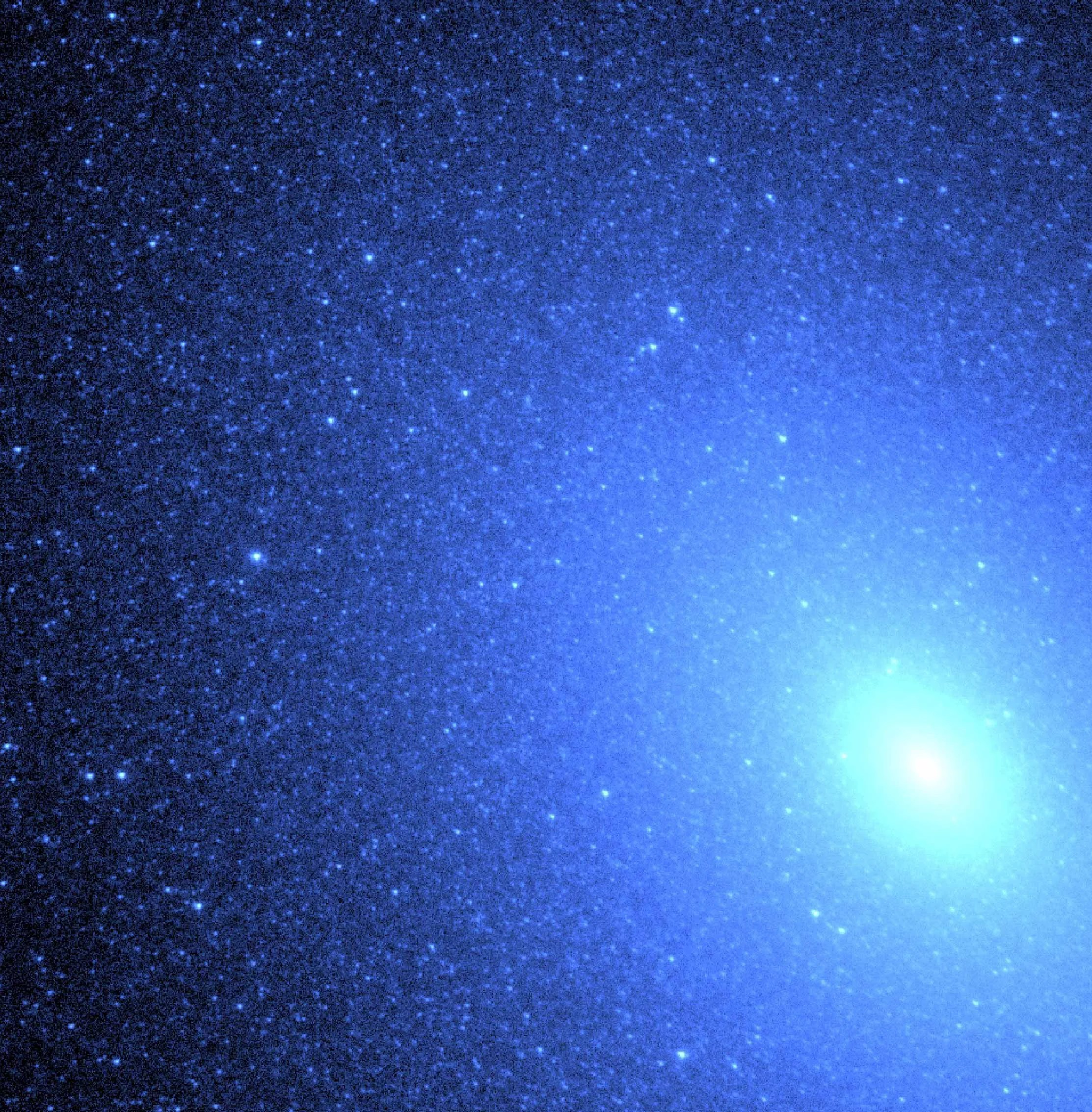 A bluish image of the core and surrounding of a companion galaxy to Andromeda. The color is due to the image being taken in ultraviolet light.