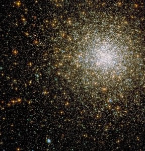A sparkling cluster of yellow and white stars, primarily concentrated near the upper right.