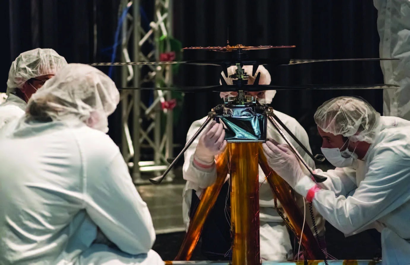 Photo of scientists working on a test with the Mars Helicopter