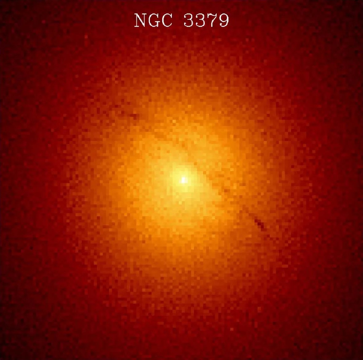 A bright, yellow-orange galaxy core shines, veering into red hues at the corners of the image.