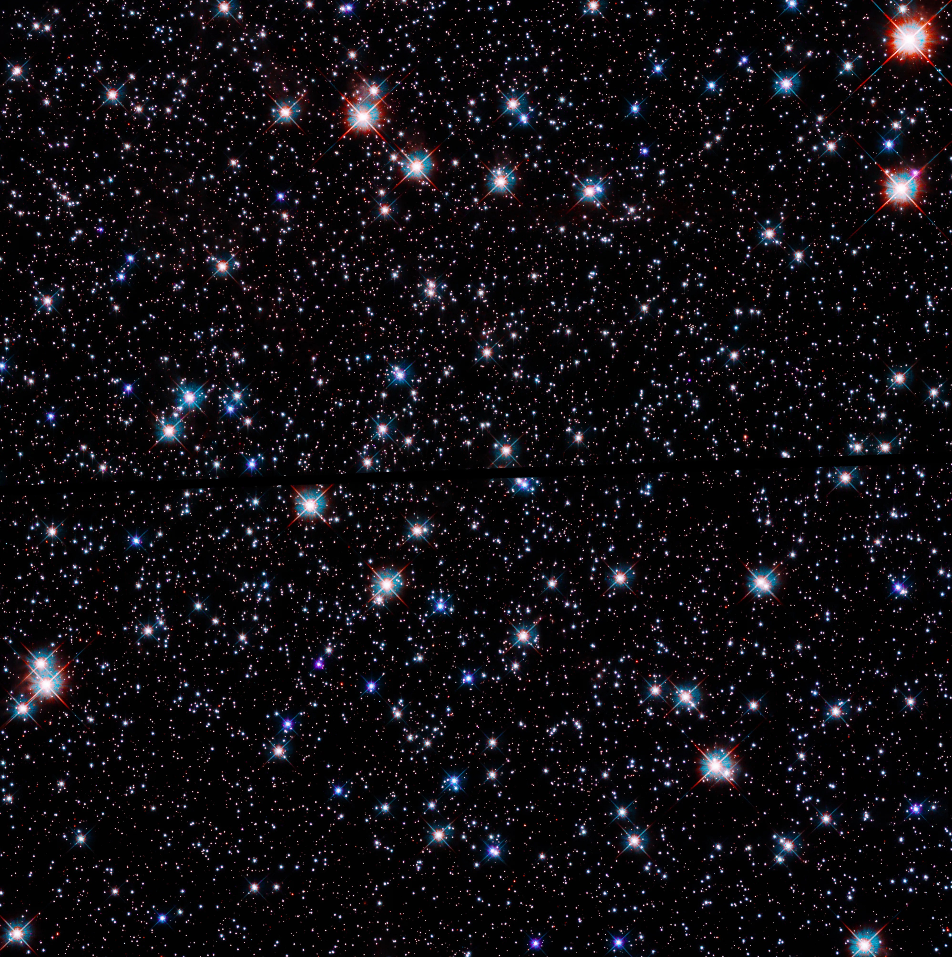 Scattered blue and white stars against a black background. A black line runs horizontally through the image.