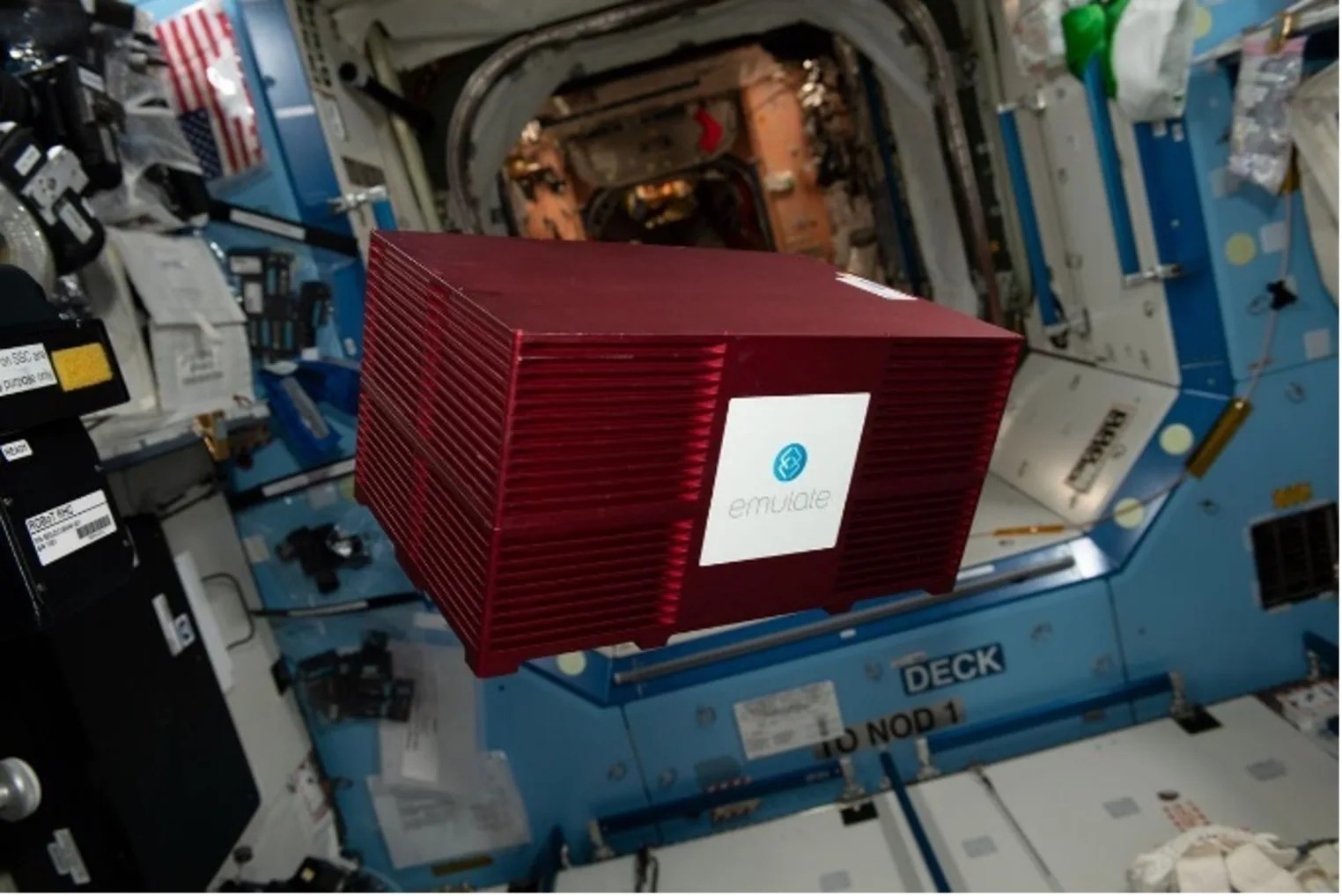 Photograph of a large red box onboard the ISS.