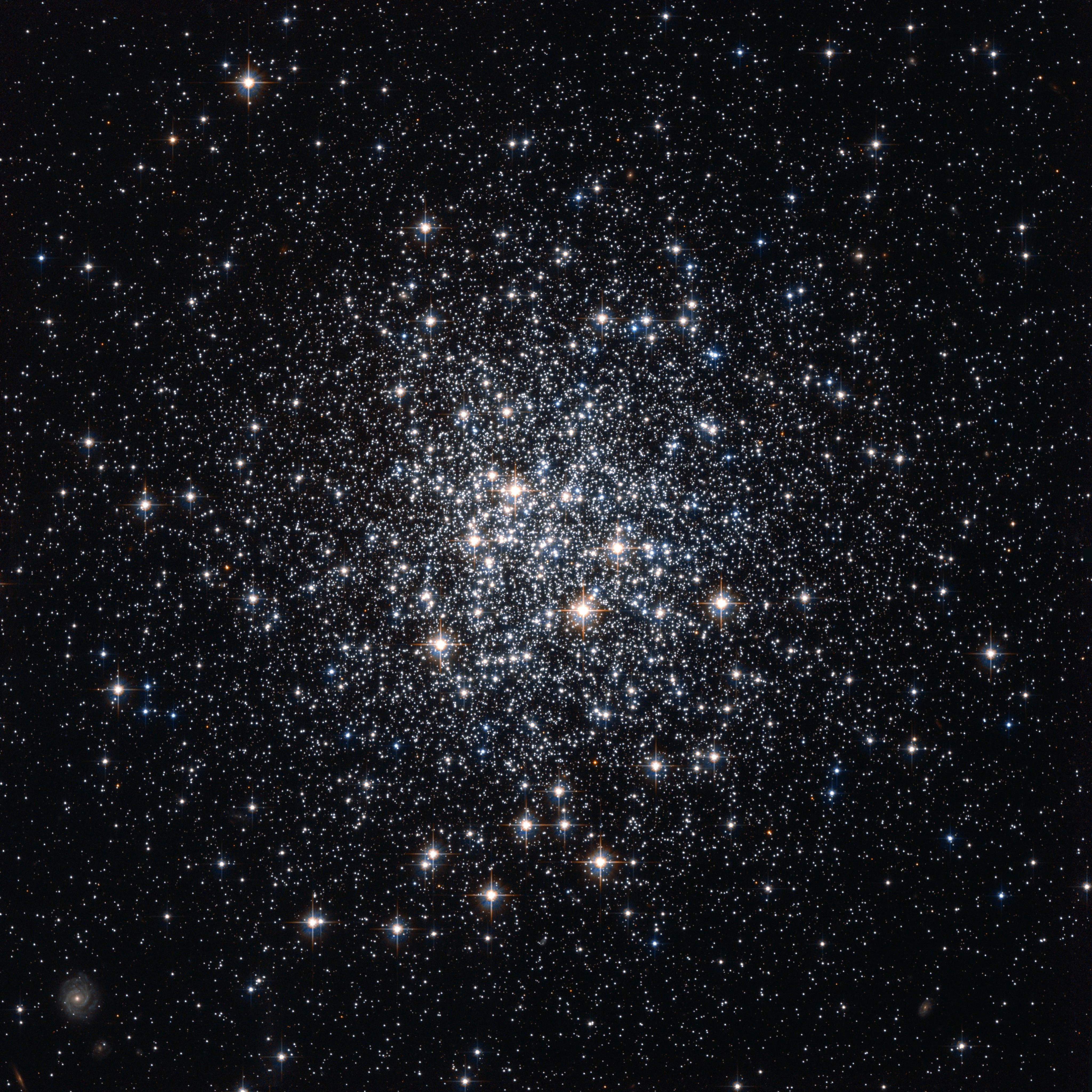 A cluster of white stars, loosely concentrated toward the center.