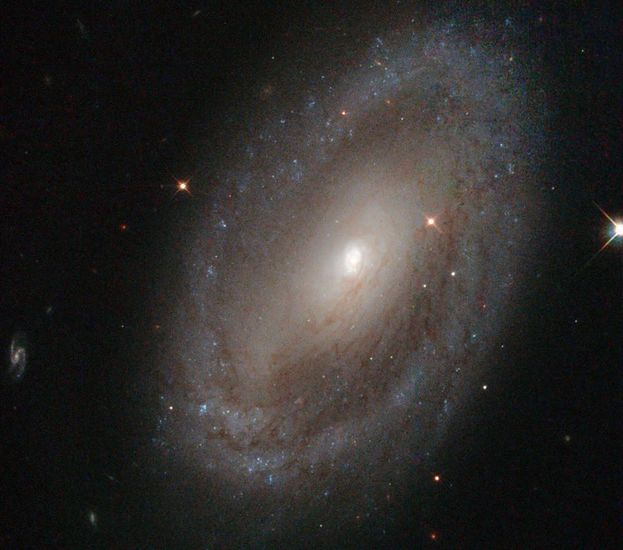 Large spiral galaxy from above with bright light in center