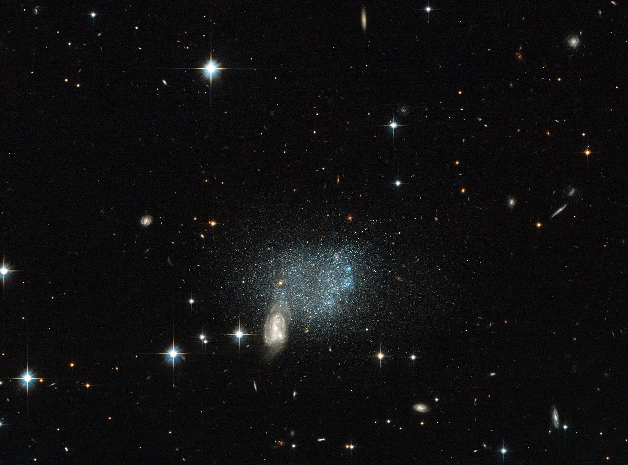 Bright stars, galaxies, and a blur of blue-gray distant stars