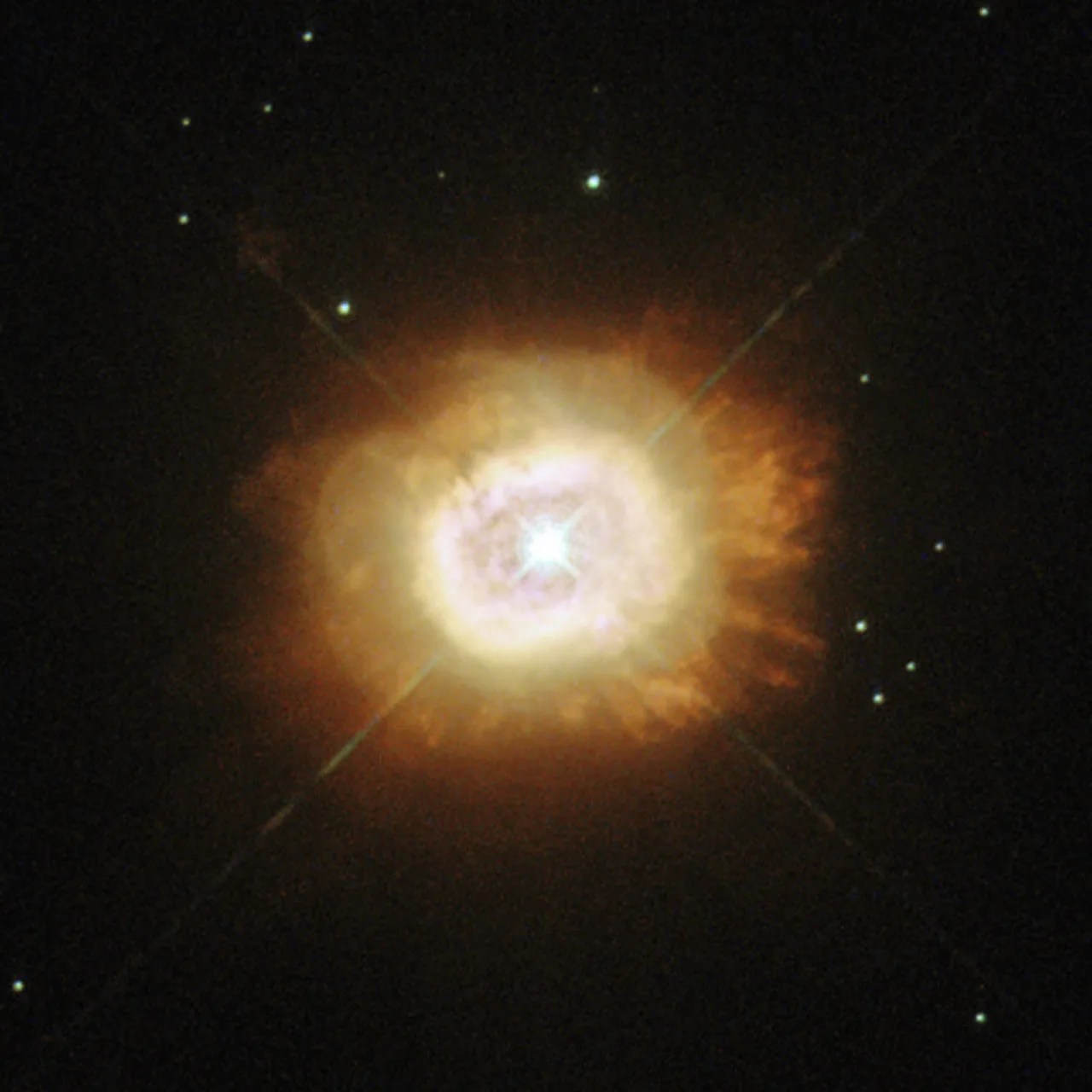 Brilliant star with lens-rays surrounded by orange vapor