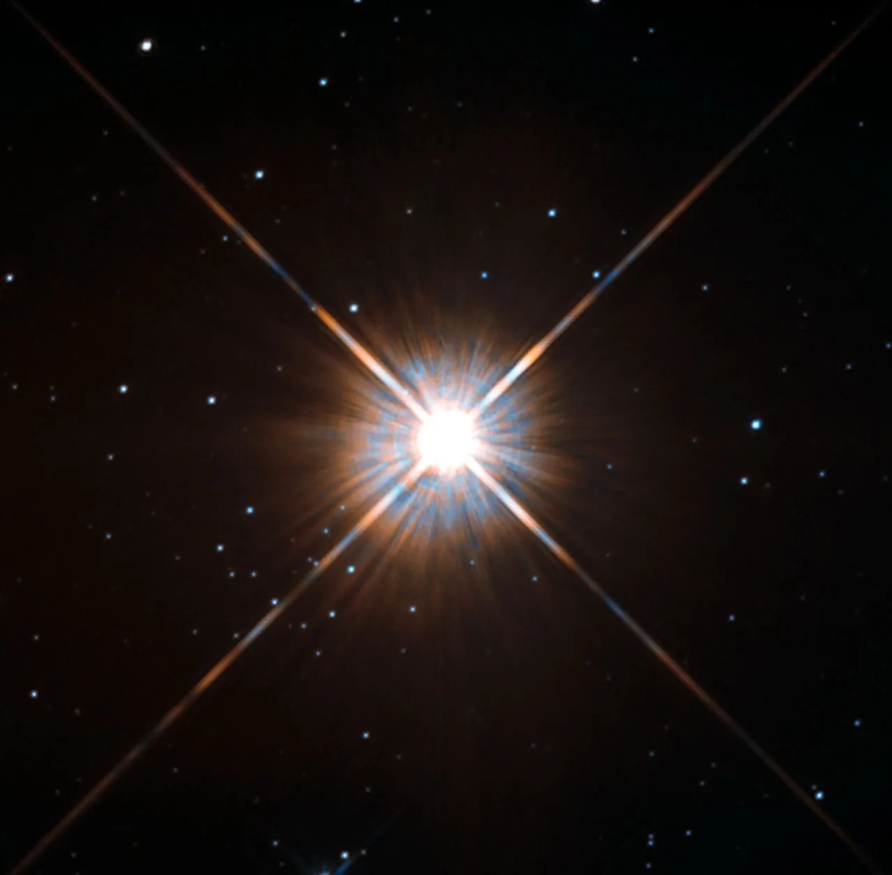 Brilliant blue-white star with x-shaped lens flare