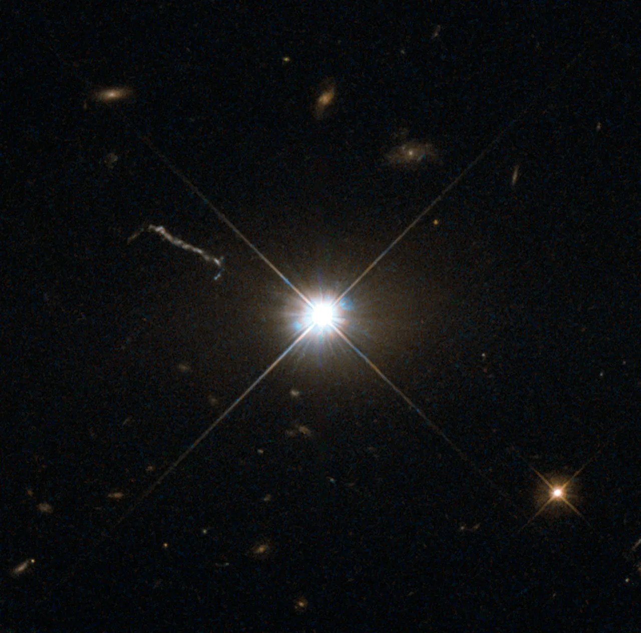 Brilliant radial quasar amid space debris