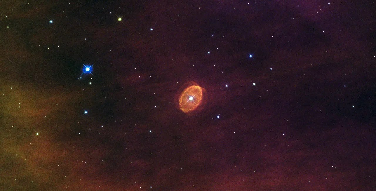 Orange ovoid shell around a bright white star