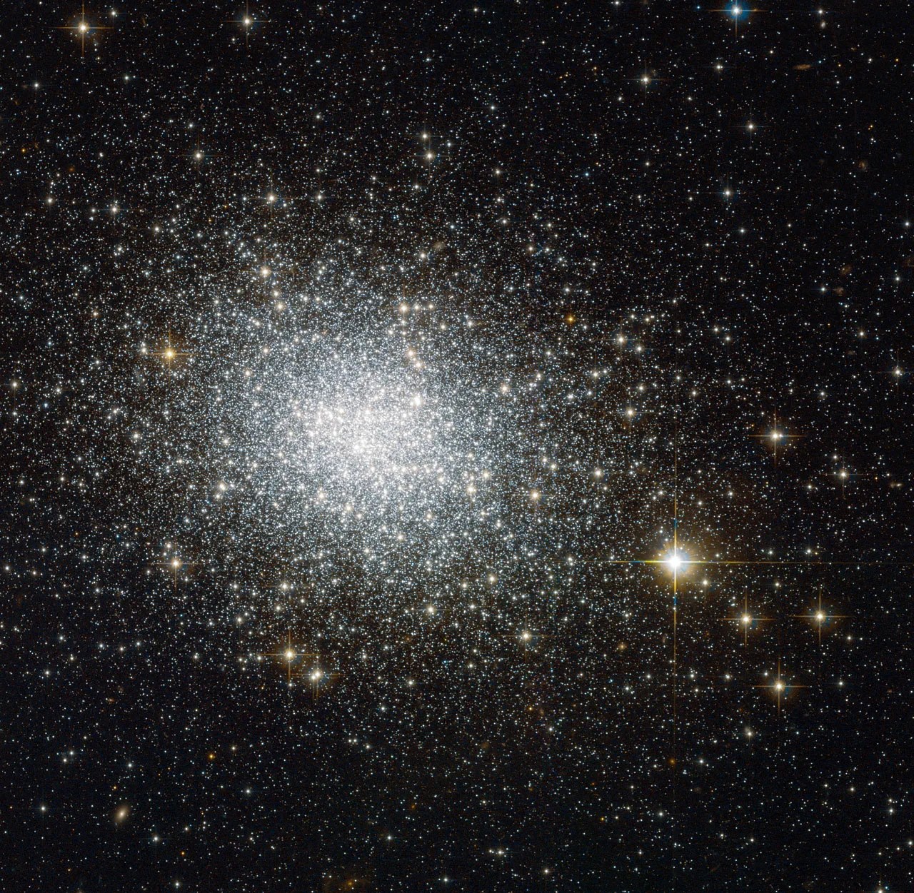 A bright glob of white stars with some yellow blazing through.