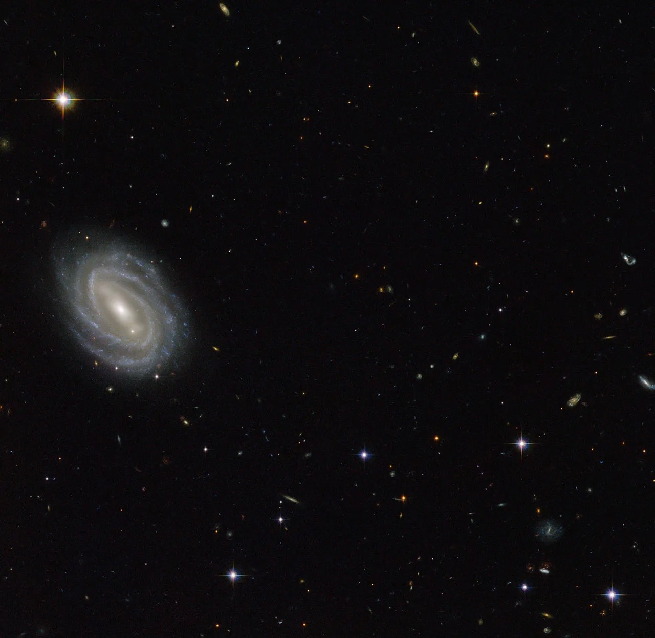 Spiral galaxy on left side of star field