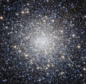 A bright cluster of stars, more concentrated at the center.