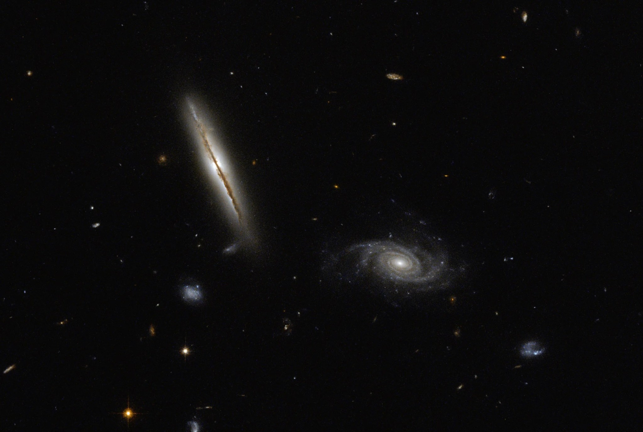 Hubble space telescope image of spiral galaxies lo95 0313-192 (left) and [loy2001] j031549.8-190623.