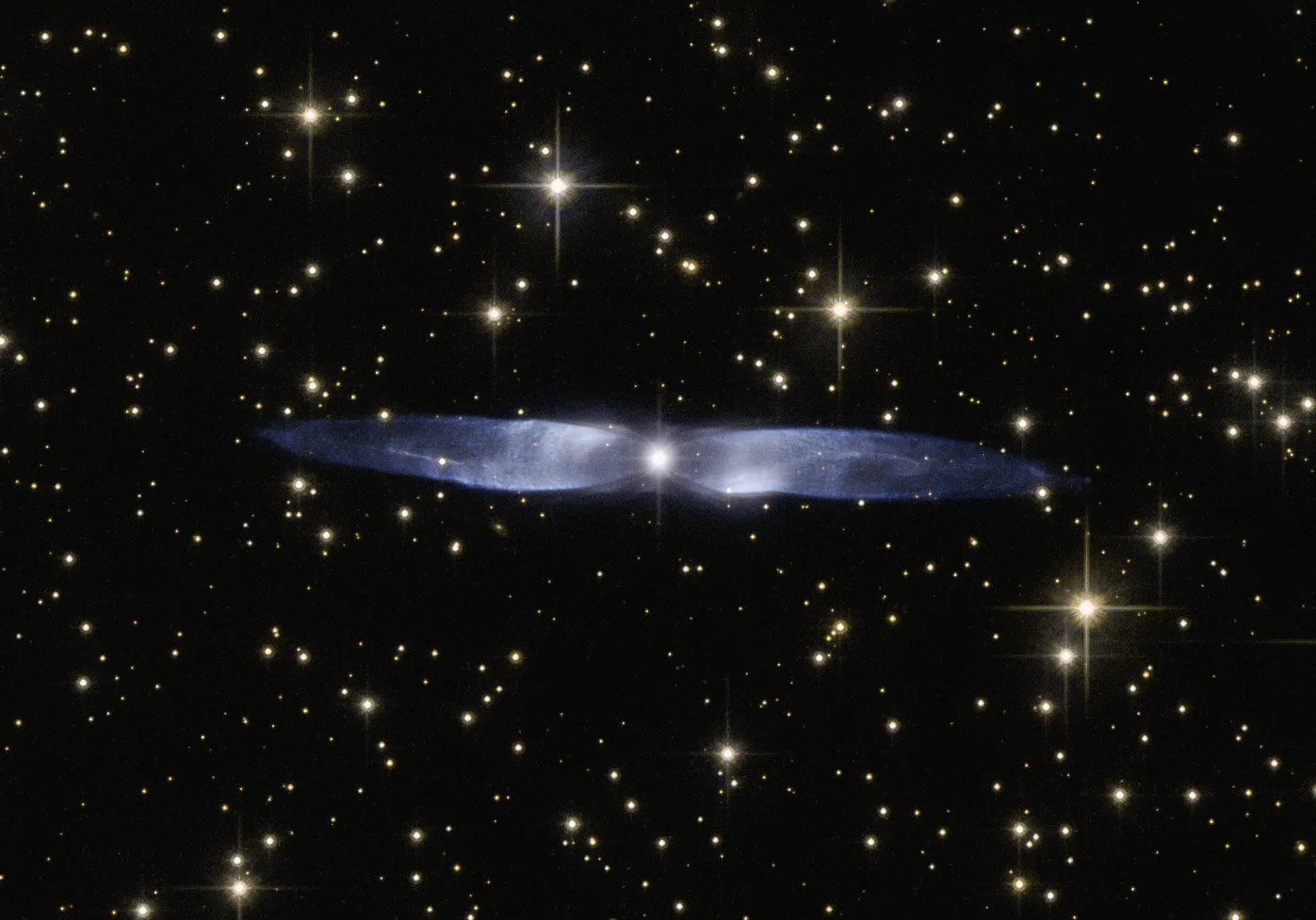 Bluish-purple "wings", very long and thing, stream out either side of a dying star. Other stars are visible in the background.
