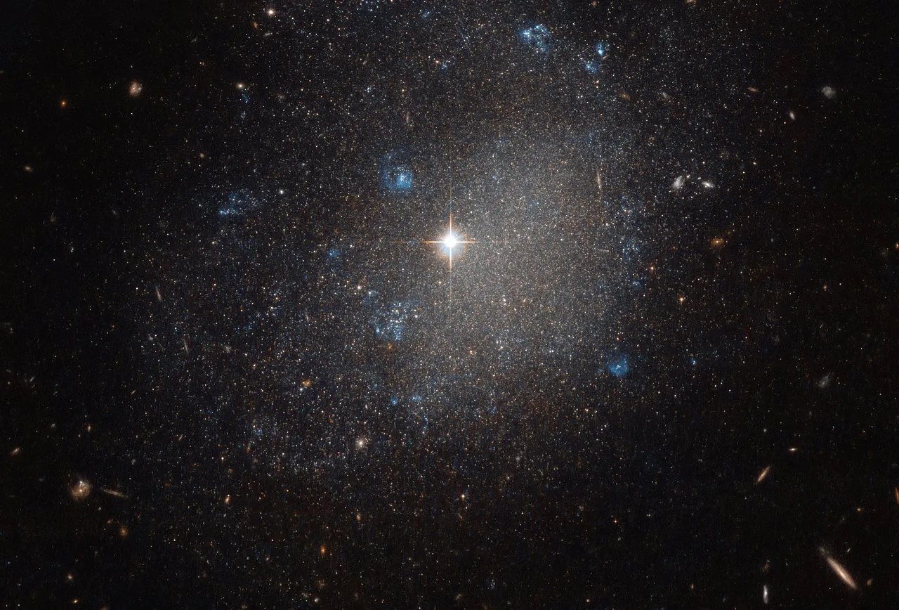 Star field with bright center and galaxies