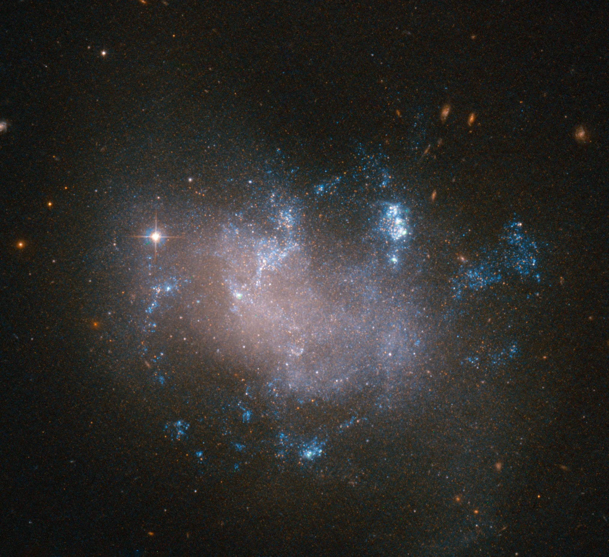 Diffuse galaxy with blue patches