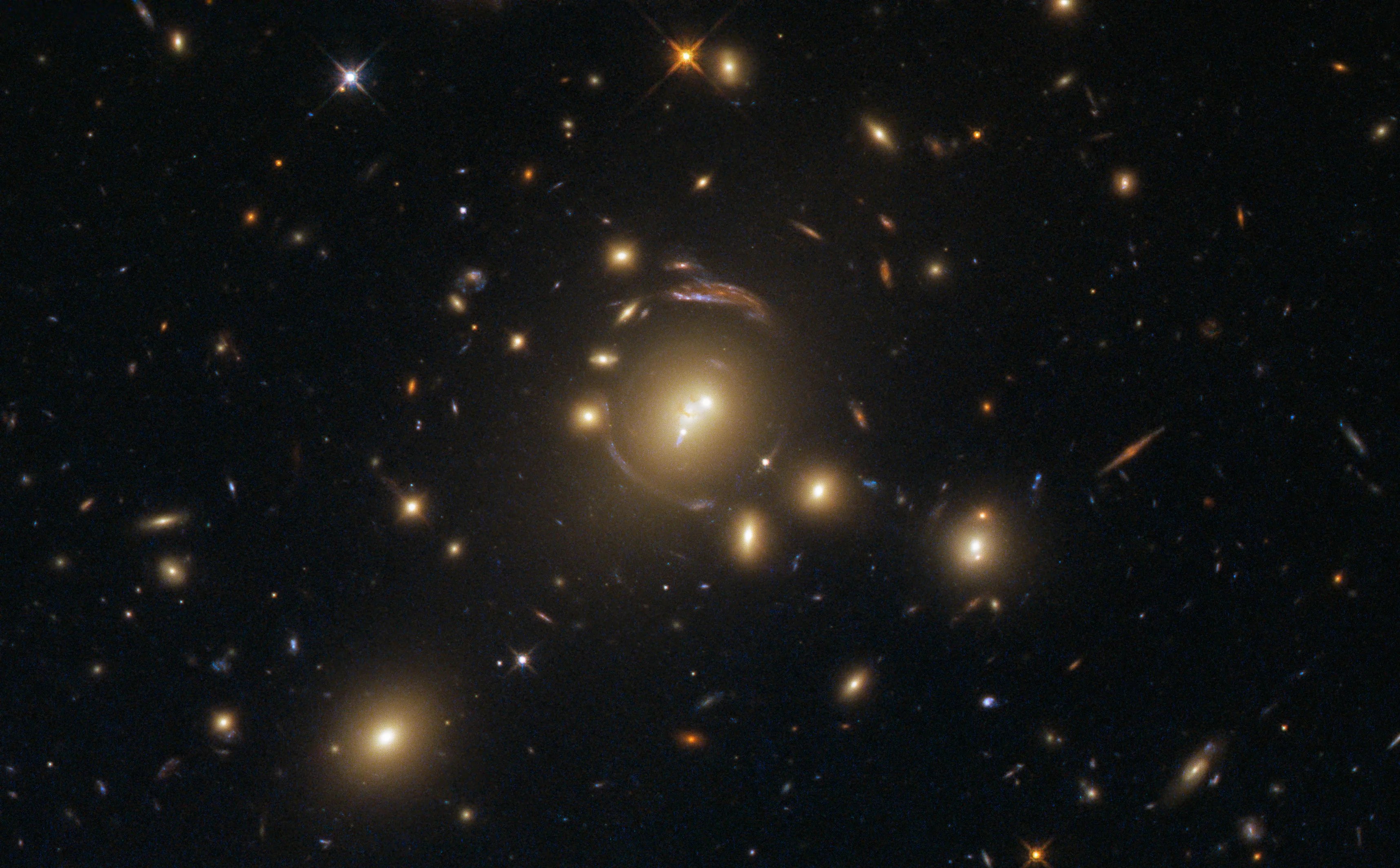Fuzzy amber blobs create ring-shaped distorted galaxies
